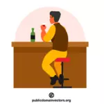 Mies juomassa baarissa