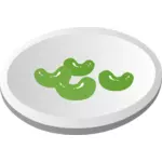 Vektorigrafiikka vihreistä papuista lautasella