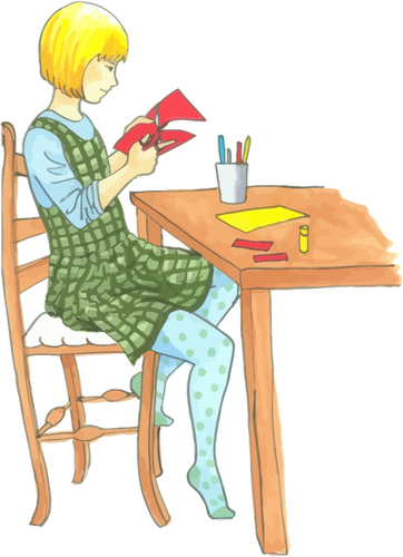 Blonde jenta gjør håndverk på en tabell