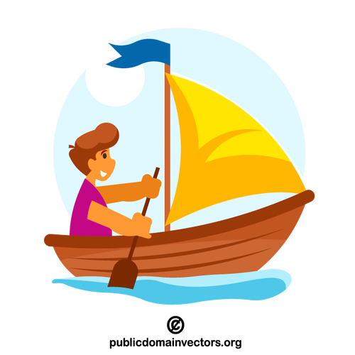 صبي في القارب الخشبي مع الشراع