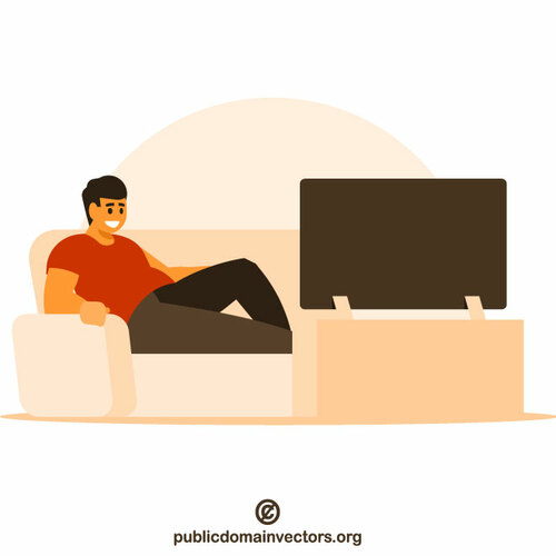 Mężczyzna siedzi i ogląda telewizję