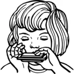 Mädchen spielen Mundharmonika