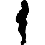 Mulher grávida em silhueta de saltos