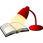 Libro abierto y lámpara de lectura