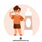 歯磨き粉で歯を磨く少年