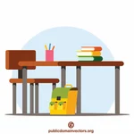 Skolskrivbord med böcker
