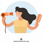 Žena suší vlasy