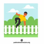 Muž skákající přes plot