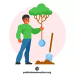 Mężczyzna sadzi drzewo