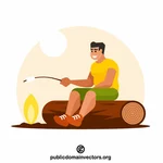 Muž pečící marshmallow