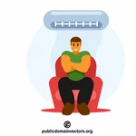 Homem sentado sob um ar condicionado