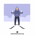 Mann står på ski