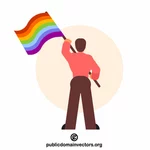 Mężczyzna macha flagą LGBT