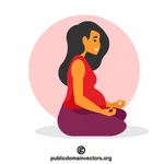 Těhotná dívka dělá jógu