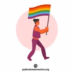 Transgender person holding rainbow flag