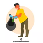 Voluntario recogiendo basura en bolsa