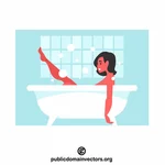Kvinna som kopplar av i ett badkar