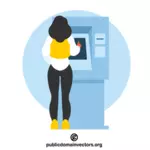 Frau benutzt einen Geldautomaten