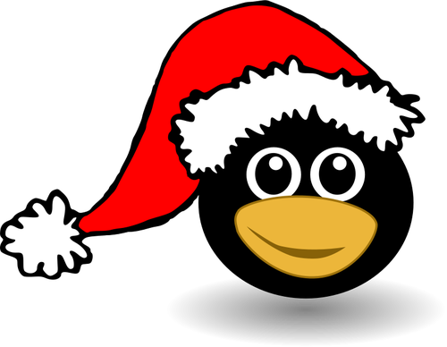 Смешное лицо пингвина в шапке Санта-Клауса