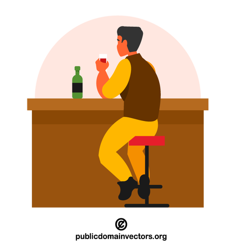 Мужчина пьет в баре