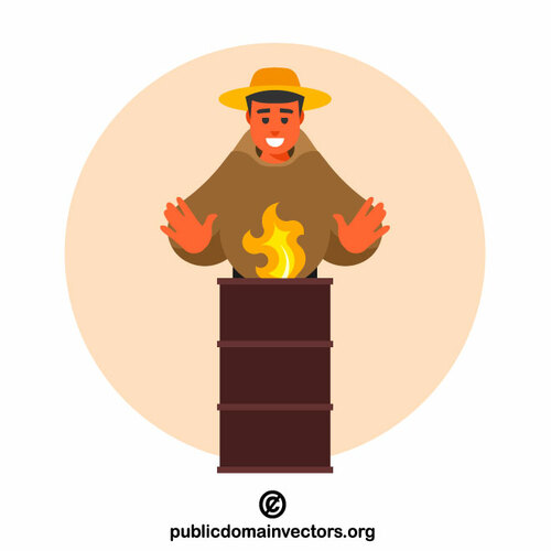 Man standing by a burning barrel