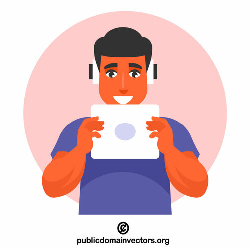 Teenager is listening to music on a tablet