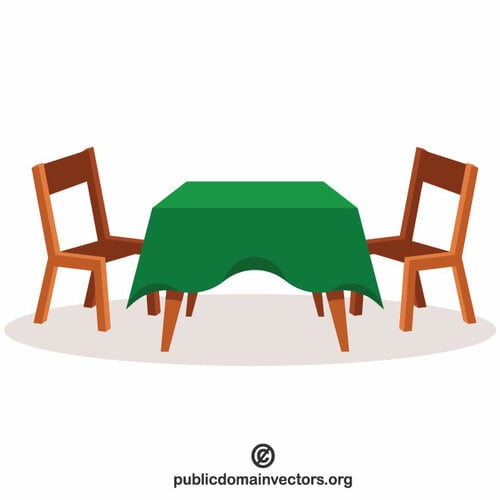 हरे रंग के मेज़पोश के साथ टेबल