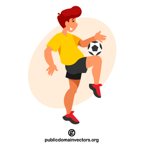 Young soccer player kicking a ball