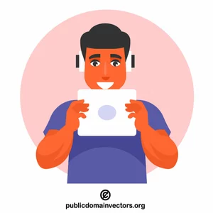 Teenager is listening to music on a tablet