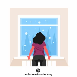 Frau schaut auf Schneefall