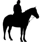 Mies hevosen selässä siluetti