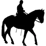Mies ratsastamassa hevosella siluetti