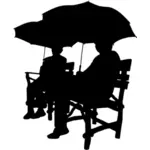 Sitting under umbrellas