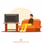 Člověk se dívá na televizi.