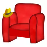 Chaise rouge et un chapeau.