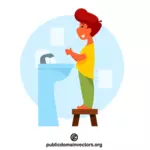 صبي في الحمام يغسل اليدين