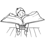Boy reading a big book