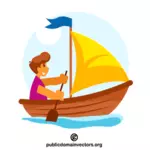 Boy in the wooden boat with a sail