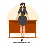 Femme d’affaires debout près de la table