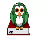 Green owl sitting on a book