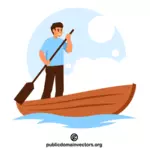 Chico feliz remando en un bote