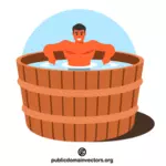 Hombre en una bañera de madera