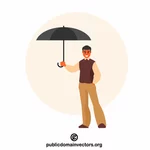 Mies sateenvarjon kanssa