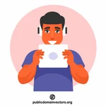 Teenager is listening to music on a tablet