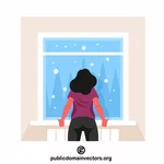 Woman is looking at snowfall