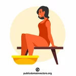 Nainen istuu jalat lantiossa