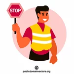 Worker holds stop sign